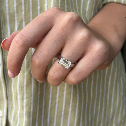 East/West Solitaire Emerald Cut Diamond With Hidden Diamond Halo Lifestyle 1