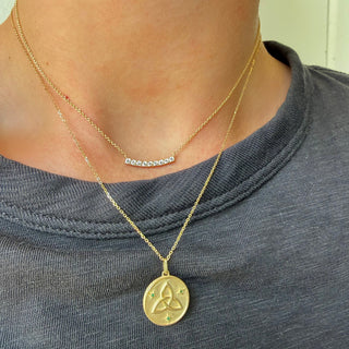 Emerald Trinity Knot Necklace Lifestyle
