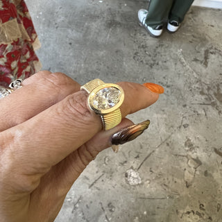 Bezel Set Oval Cut Solitaire on Detailed Gold Band  Lindsey Leigh Jewelry.
