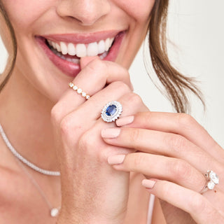 2.43ct Oval Cut Sapphire with Sunburst Halo  Lindsey Leigh Jewelry.
