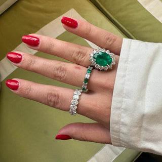 Oval Cut Emerald with Jumbo Round Diamond Halo  Lindsey Leigh Jewelry.
