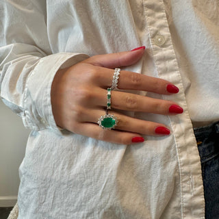Oval Cut Emerald with Jumbo Round Diamond Halo  Lindsey Leigh Jewelry.
