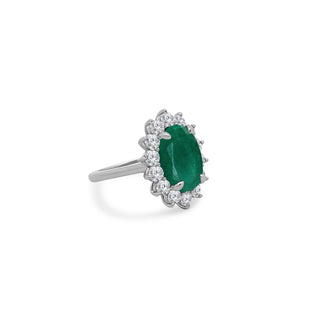 Oval Cut Emerald with Jumbo Round Diamond Halo  Lindsey Leigh Jewelry.
