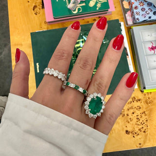 Oval Cut Emerald with Jumbo Round Diamond Halo  Lindsey Leigh Jewelry.
