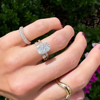 Oval Cut Solitaire on Channel Set Diamond Band  Lindsey Leigh Jewelry.
