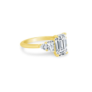 Emerald Cut Diamond with Trapezoid and Trillion Side Stones  Lindsey Leigh Jewelry.
