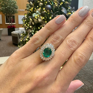 Oval Cut Emerald with Sunburst Halo  Lindsey Leigh Jewelry.
