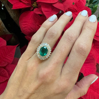Oval Cut Emerald with Sunburst Halo  Lindsey Leigh Jewelry.
