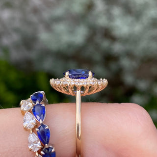 Oval Cut Sapphire with Sunburst Halo  Lindsey Leigh Jewelry.
