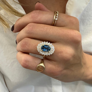 Oval Cut Sapphire with Sunburst Halo  Lindsey Leigh Jewelry.
