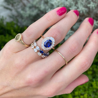 Oval Cut Sapphire with Sunburst Halo  Lindsey Leigh Jewelry.
