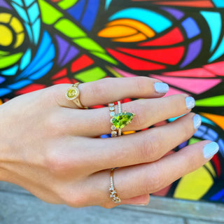 Offset Pear Cut Peridot Solitaire on Diamond Band  Lindsey Leigh Jewelry.

