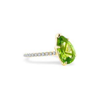 Offset Pear Cut Peridot Solitaire on Diamond Band  Lindsey Leigh Jewelry.

